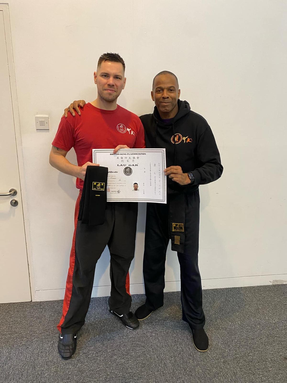 Adult student receiving Lau Gar black sash