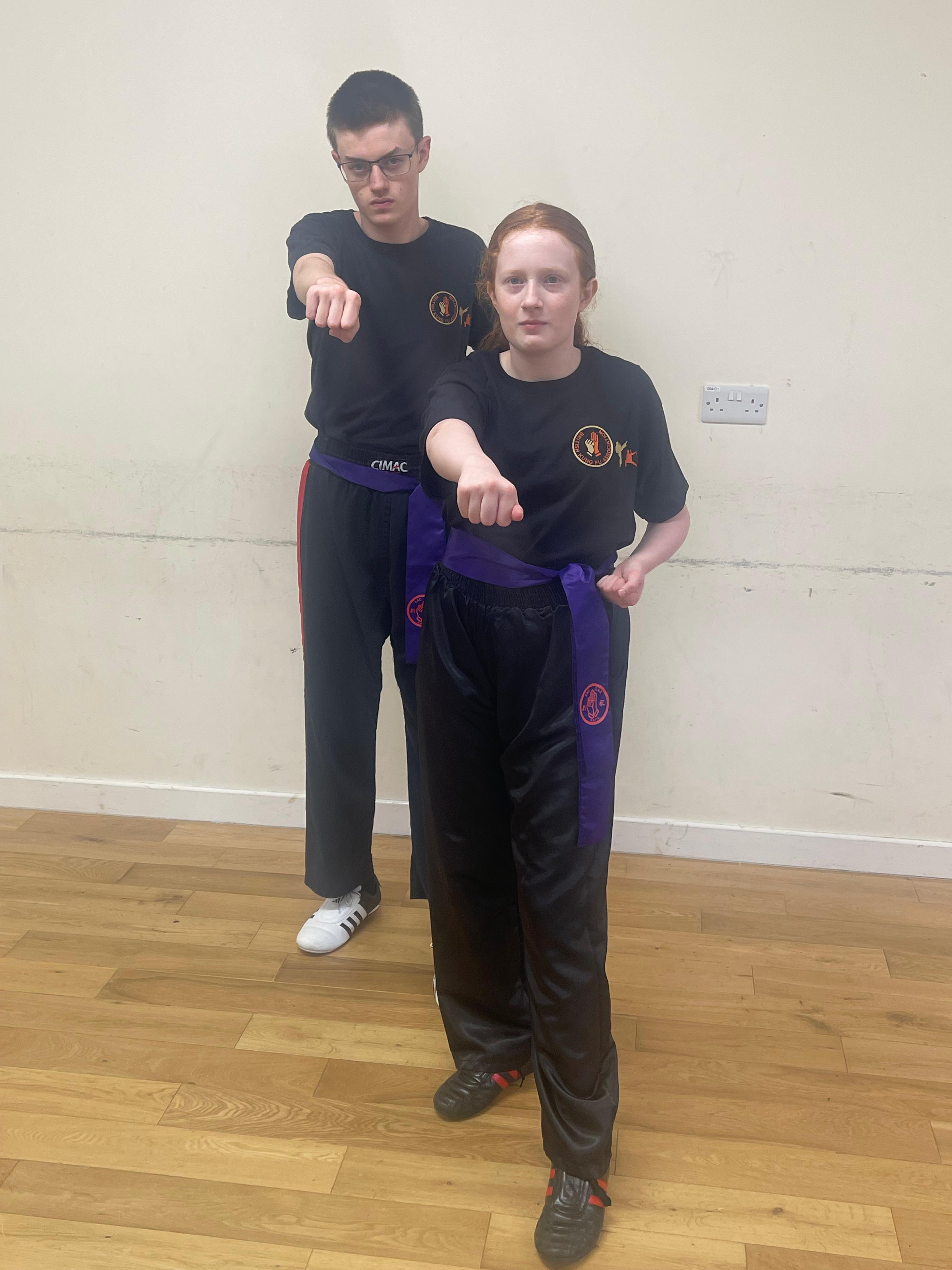 Charlotte and Simon Bloomfield wearing their purple sashes